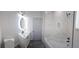 Bathroom featuring tile shower over tub and single sink vanity at 3001 E 25Th Ave, Tampa, FL 33605