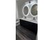 Modern bathroom featuring a double vanity with lighted mirrors at 3001 E 25Th Ave, Tampa, FL 33605