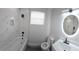 Bathroom features a shower over tub, single sink vanity, and medicine cabinet at 3001 E 25Th Ave, Tampa, FL 33605