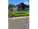 Charming single-story home with a well-manicured lawn and attached garage at 3001 E 25Th Ave, Tampa, FL 33605