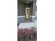 Striking front door with columns and beautiful flower beds out front at 3001 E 25Th Ave, Tampa, FL 33605