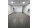Unfinished garage with concrete flooring and ample space at 3001 E 25Th Ave, Tampa, FL 33605