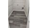 Neat laundry room featuring wood-look floors, bright white walls, and convenient washer/dryer hookups at 3001 E 25Th Ave, Tampa, FL 33605
