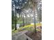 Peaceful lakeside walkway with lush greenery and natural light at 5821 Legacy Crescent Pl # 301, Riverview, FL 33578