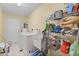 Laundry room with washer, dryer, and storage shelves at 12361 State Road 31, Punta Gorda, FL 33982