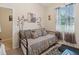 Cozy bedroom with a daybed and zebra-themed decor at 11724 Holly Creek Dr, Riverview, FL 33569