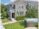 Charming two-story home featuring a well-manicured lawn and attached garage at 6357 Shore Vista Pl, Apollo Beach, FL 33572