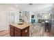 Open kitchen with a granite island, breakfast bar, and seamless flow to the living spaces at 6357 Shore Vista Pl, Apollo Beach, FL 33572