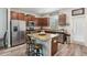 Well-equipped kitchen with granite countertops, stainless steel appliances, and breakfast bar at 6357 Shore Vista Pl, Apollo Beach, FL 33572