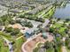 Aerial view of community playground with swings, slides, and lush landscaping next to a lake at 6357 Shore Vista Pl, Apollo Beach, FL 33572
