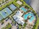 Aerial view of community pool, tennis court, basketball court, volleyball court, and grassy areas at 6357 Shore Vista Pl, Apollo Beach, FL 33572
