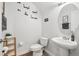 Stylish powder room with modern fixtures and tasteful decor at 6357 Shore Vista Pl, Apollo Beach, FL 33572
