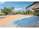 Community splash pad area with various water features and plenty of seating, shaded by surrounding trees at 6357 Shore Vista Pl, Apollo Beach, FL 33572