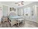 Main bedroom with light blue bedding and two night stands at 6357 Shore Vista Pl, Apollo Beach, FL 33572