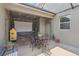 Outdoor patio with seating area and projector at 6357 Shore Vista Pl, Apollo Beach, FL 33572