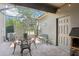 Relaxing patio with seating area, screened enclosure, and brick pavers at 6357 Shore Vista Pl, Apollo Beach, FL 33572