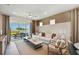 Spacious living room with lake view and sliding glass doors at 9210 Ballaster Pointe Loop, Parrish, FL 34219