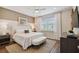 Relaxing bedroom with plush bedding and ample natural light at 9210 Ballaster Pointe Loop, Parrish, FL 34219