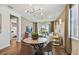 Bright dining area with hardwood floors and view to living room at 9210 Ballaster Pointe Loop, Parrish, FL 34219