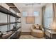 Cozy office space with built-in shelving and comfortable seating at 9210 Ballaster Pointe Loop, Parrish, FL 34219