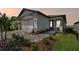 Two-story home with a two-car garage and landscaped yard at 9210 Ballaster Pointe Loop, Parrish, FL 34219