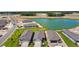 Aerial view of new homes and a lake in a new community at 9210 Ballaster Pointe Loop, Parrish, FL 34219