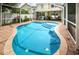 Enjoy this refreshing blue swimming pool with screened enclosure at 903 Woodbridge Ct, Safety Harbor, FL 34695