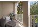 Outdoor balcony offering a tranquil view of the surrounding trees at 6002 Printery St # 103, Tampa, FL 33616