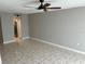 Bright living room with tile floors and ceiling fan at 811 Russell Ln # 309, Brandon, FL 33510