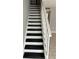 Interior staircase with black and white carpeting at 811 Russell Ln # 309, Brandon, FL 33510