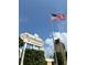 Community entrance with sign and flagpole at 811 Russell Ln # 309, Brandon, FL 33510