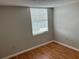 Bright bedroom featuring hardwood floors and window blinds at 811 Russell Ln # 309, Brandon, FL 33510