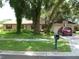 Brick ranch home with a two car garage and basketball hoop at 803 Bills Cir, Brandon, FL 33511