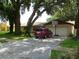 Brick ranch home with a two-car garage and a basketball hoop at 803 Bills Cir, Brandon, FL 33511