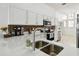 Updated kitchen featuring white cabinets, quartz countertops, and stainless steel appliances at 1130 Big Creek Dr, Wesley Chapel, FL 33544