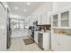 Beautiful kitchen with stainless appliances, custom backsplash and white cabinets at 1130 Big Creek Dr, Wesley Chapel, FL 33544