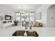 Open concept view from kitchen sink into the bright and airy living room at 1130 Big Creek Dr, Wesley Chapel, FL 33544