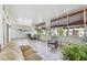 Spacious screened lanai featuring ample natural light, neutral tile, and multiple seating areas at 1130 Big Creek Dr, Wesley Chapel, FL 33544
