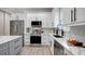 Modern kitchen with white shaker cabinets and quartz countertops at 3410 E Henry Ave, Tampa, FL 33610