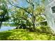 Backyard oasis with lake view and lush greenery at 7156 E Bank Dr # 7156, Tampa, FL 33617