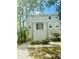 Two-story building exterior with landscaping and walkway at 7156 E Bank Dr # 7156, Tampa, FL 33617