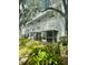 Two-story building with screened porch and landscaping at 7156 E Bank Dr # 7156, Tampa, FL 33617