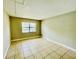 Bright bedroom featuring tile flooring and a window with natural light at 7156 E Bank Dr # 7156, Tampa, FL 33617