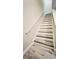 Modern staircase with light wood and white railing at 7156 E Bank Dr # 7156, Tampa, FL 33617