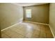 Simple bedroom with tile flooring and a closet at 7156 E Bank Dr # 7156, Tampa, FL 33617