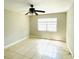Bright bedroom with tile flooring and ceiling fan at 7156 E Bank Dr # 7156, Tampa, FL 33617