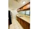 Kitchen with wood cabinets and granite countertops at 7156 E Bank Dr # 7156, Tampa, FL 33617