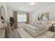 Spacious bedroom with neutral decor and large window at 2996 Forest Meadow Ave, Valrico, FL 33594