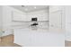 Modern kitchen with white cabinets and quartz countertops at 3008 Forest Meadow Ave, Valrico, FL 33594