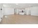 Open concept living area with light wood flooring at 3008 Forest Meadow Ave, Valrico, FL 33594